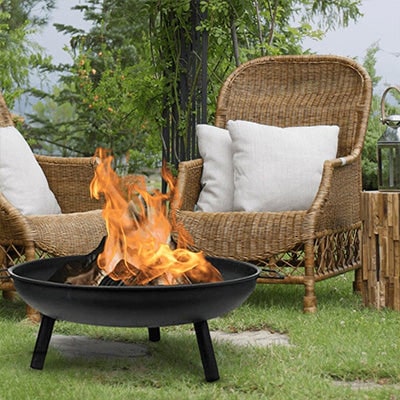 Wicker chairs around circular firepit