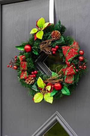 christmas-wreath-red-baubles-berries-poinsettia